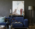Accenting the interior is a large navy blue sofa