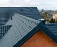 Roof complete with Venecja D-Matt 7016 modular tile roof finished with GS-LUX ridge and Venecja modular wind vane