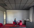 Ecophon Maste Eg ceiling system in a dark Silk Slate color was used in the offices of the Family Group company