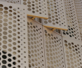 Perforated sheets help with ventilation and shading of buildings
