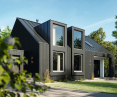 Single-family house with large fixed and tilt and turn windows in Schüco FocusIng system