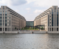 Symmetrical modern buildings on the river