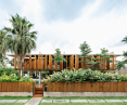 Modern two-story building with wooden shutters, surrounded by tropical vegetation