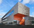 Modern school building with brick facade and large windows