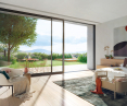 Schüco ASE 80 sliding door system with zero millimeter threshold provides a seamless transition between living room and garden