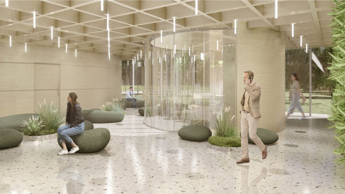 Reprezentacyjne lobby, zielona ściana i siedziska w formie kamieni