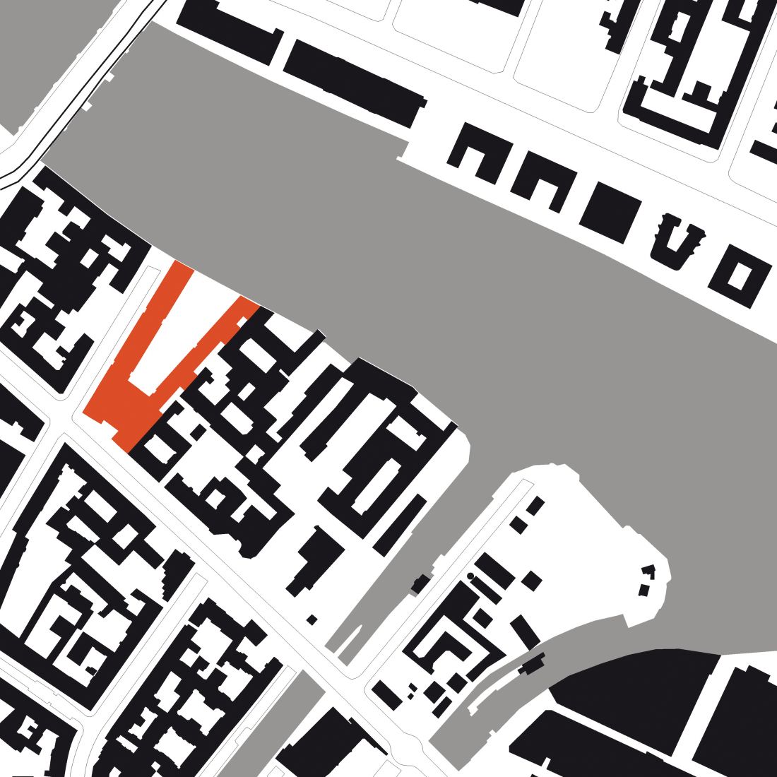 Mapa terenu z zaznaczonymi budynkami na czarno i z budynkiem Curvy Campus zaznaczonym na czerwono