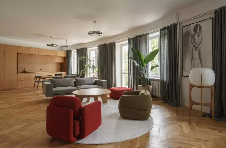 Interior adaptation of an apartment in Warsaw's Ochota district with photographs by Helmut Newton