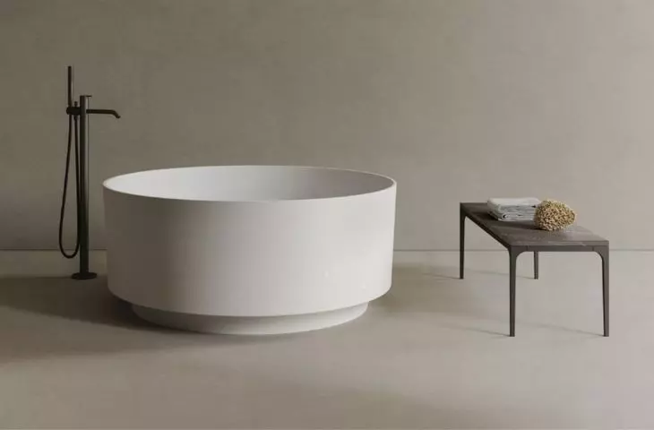 Baths all around. A bathtub in an unusual shape