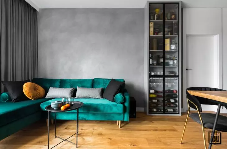 An apartment with wood, black and white