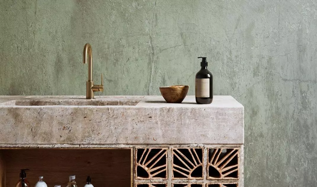 Stone washbasin with an openwork bottom panel