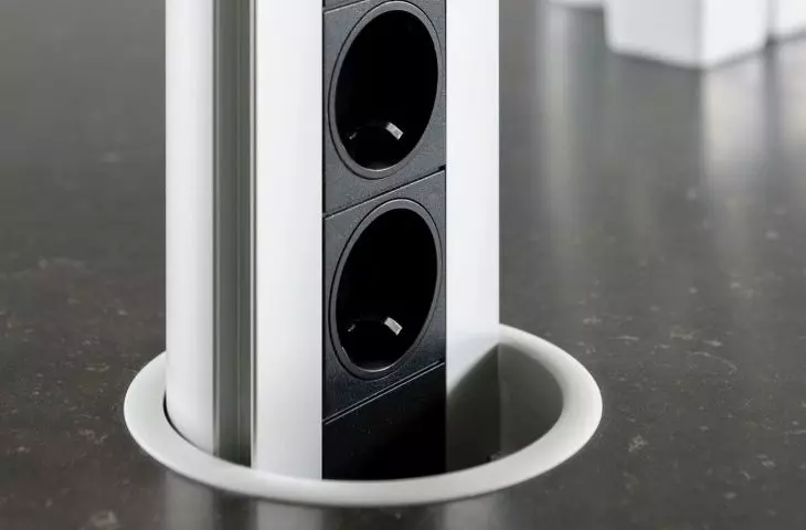 Electrical outlets hidden in the countertop - an aesthetic and practical solution in the kitchen