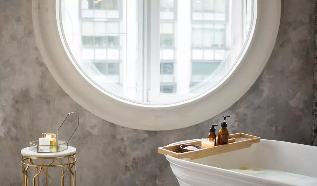Round window decorating the interior of the bathroom