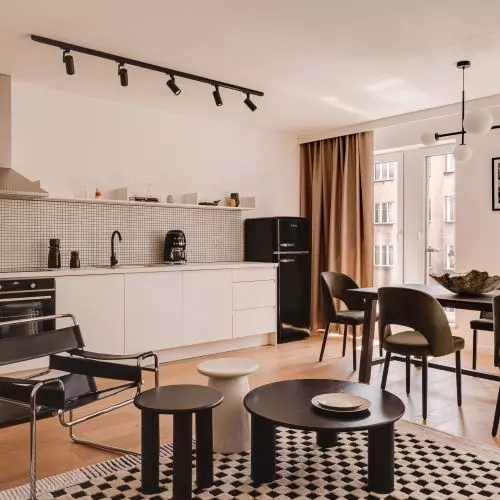 Stylowy odpoczynek w Krakowie. Wnętrze aparthotelu w stylu mid-century