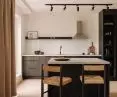 The minimalist apartment is located in Krakow