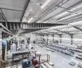 Production hall in welded frame technology with trapezoidal web