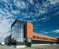 Budynek biurowy i centrum logistyczne piekarni Putka, elewacja z płytki mineralnej SAHARA