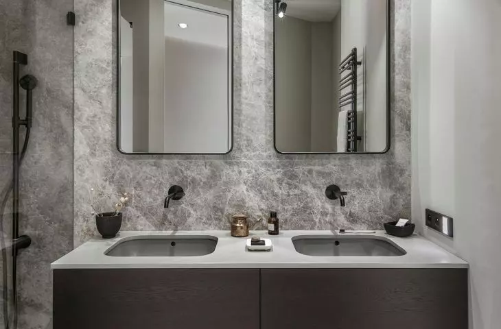 Between white and black. Bathrooms and toilets in muted colors