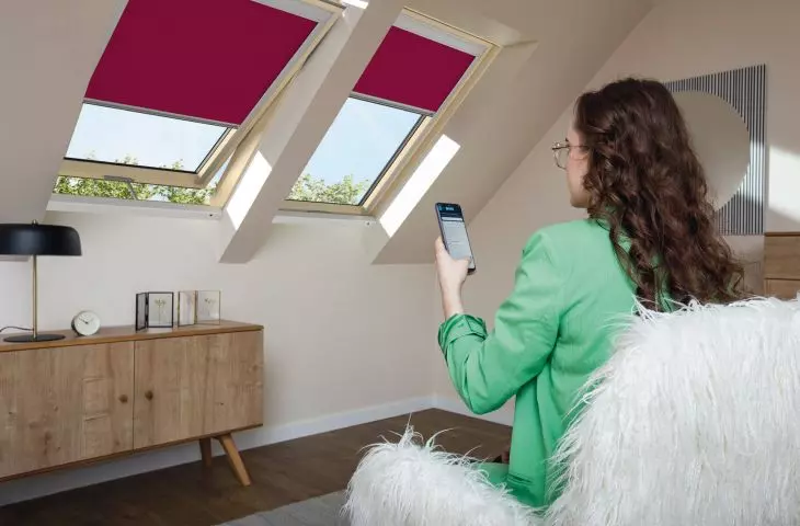 Fakro roller blinds in the joyful color of Viva Magenta