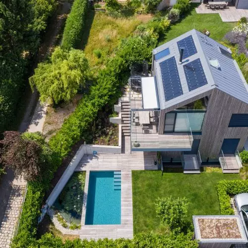Solar panels integrated into a standing seam roof
