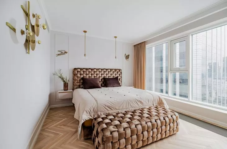 Warm colors and distinctive decorations. Bedroom arrangement with a view