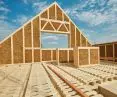 The house is built using modular technology with wood-framed elements and an infill of heavily compressed straw (straw-bale)