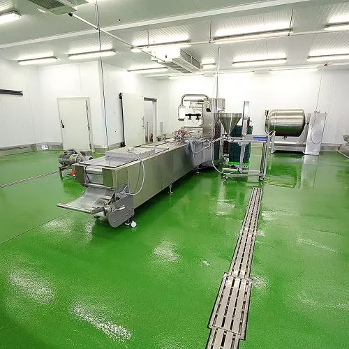 What properties should resin floors used in meat plants have