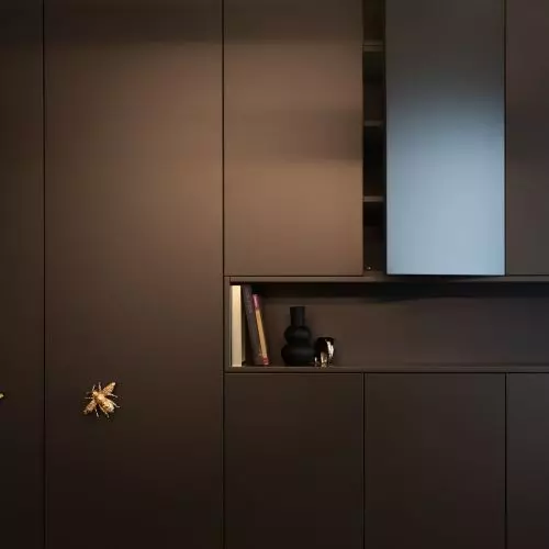 Matte black and handles covered with 24k gold. Apartment designed for a young man