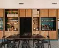 Pieno's restaurant was to be distinguished by the way it was organized, by its color scheme, and also, by its unique bookcase