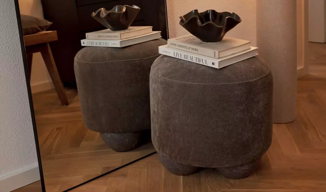 The pouffe is a versatile piece of furniture that will work in many rooms