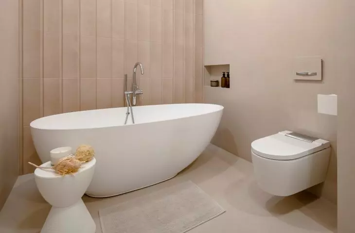 Two bathroom arrangements with microcement