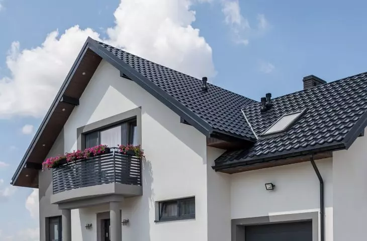 How does a gutter system affect the aesthetics and functionality of buildings?