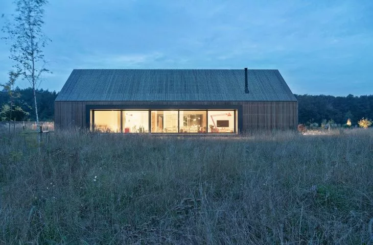 Modern barn in the middle of a field from PL.architekci