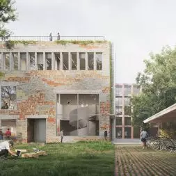 widok na zielone wnętrze urbanistyczne oraz na elewację frontową budynku zbiorów