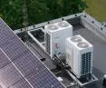Installation of Rotenso RVF air conditioning system on the roof of the building integrated with photovoltaic installation