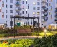 Hanging bench under pergola with community library module