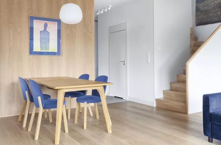 Interior with blue accents. Design by Ktura Architects