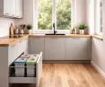 How can you set up a convenient waste sorting area in the kitchen?