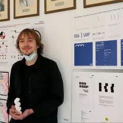 Mikołaj Niewęgłowski, zwycięzca głównej nagrody na tle pracy