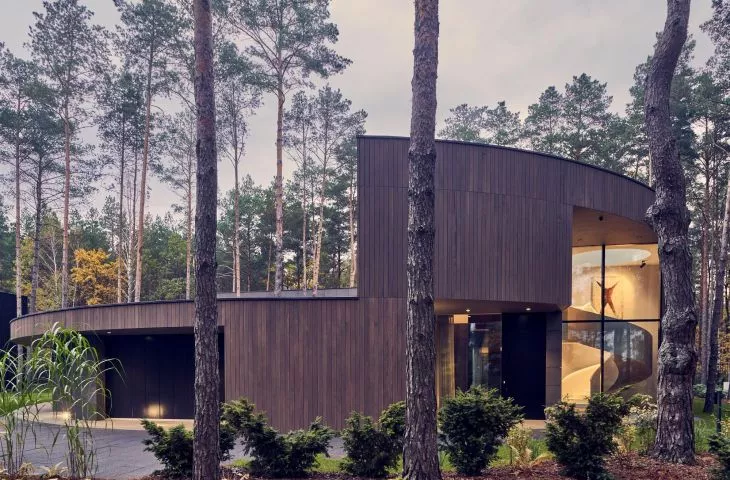 What does the forest hide? Circle Wood House from Mobius Architects with European Property Awards.