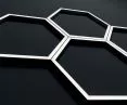 HEXAGON can be hung on the wall, ceiling or placed as a decorative desk lamp