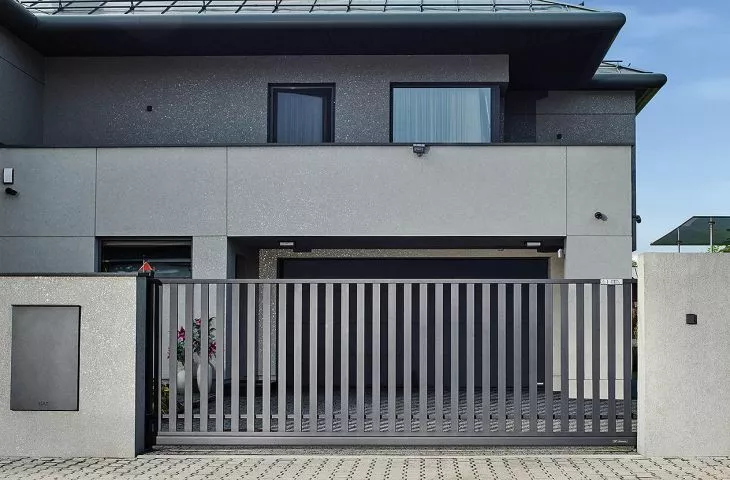Home Inclusive Idea. Fence, garage door, windows, doors and facade in one style