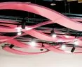The ceiling in a Serbian market decorates the interior and masks the technical installations running just below the ceiling