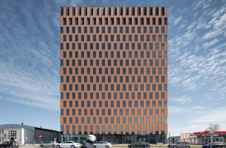 A rusty, modern office building in Gdansk. Wave project by medusa group