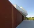Wuzetka house, layers of sponge cake and cream were replaced with contrasting plaster and corten