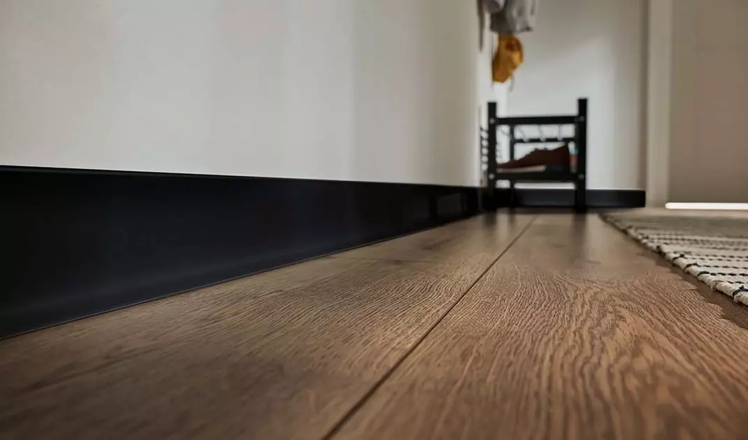 The strip protects the wall from impacts and moisture