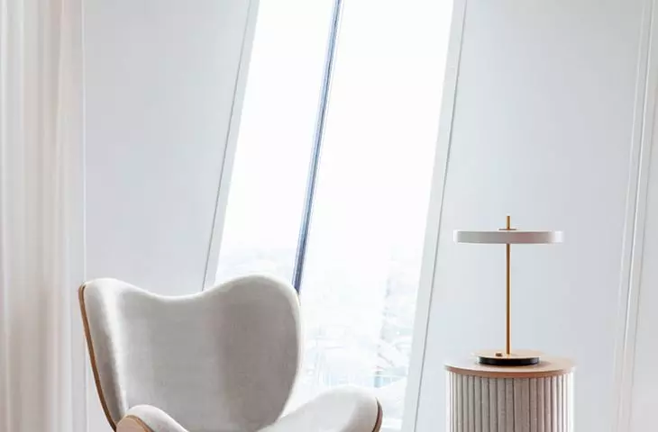 A Conversation Piece armchair, Audacious upholstered table, Umage