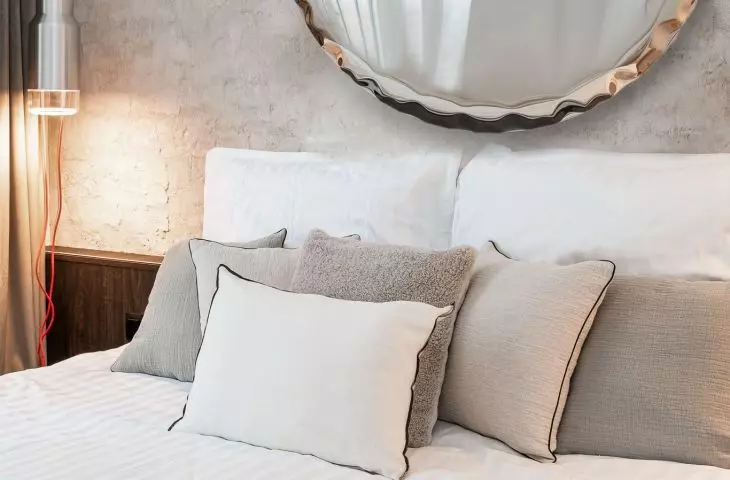 The wall behind the bed was decorated with a special plaster