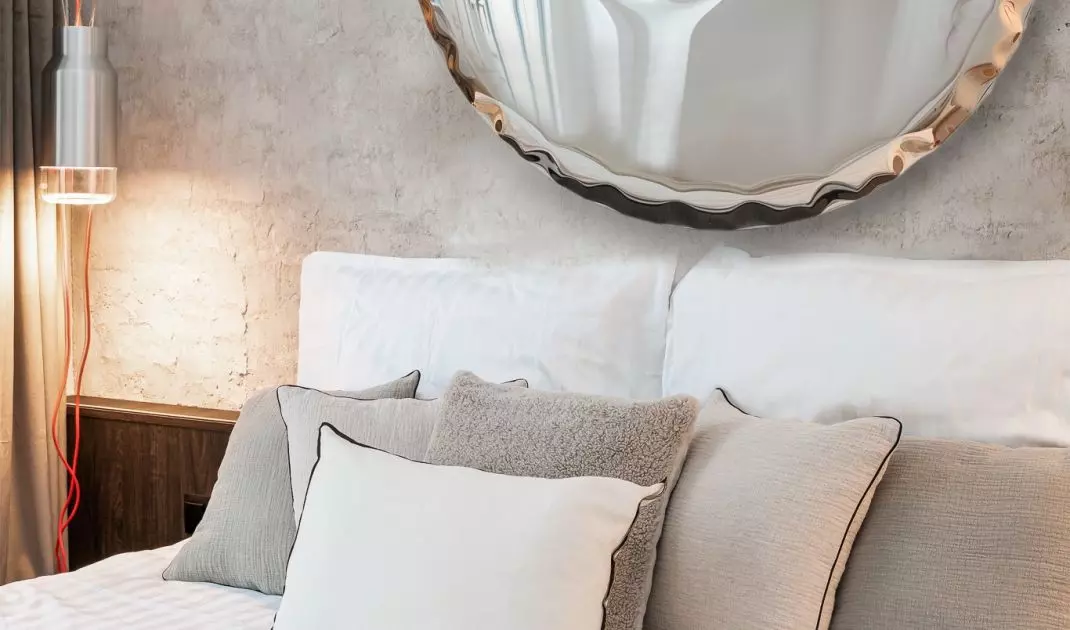 The wall behind the bed was decorated with a special plaster