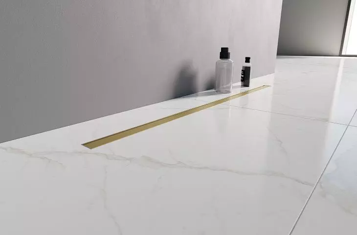 Linear drainage with grating in brushed gold color from Visio Slim Gold collection